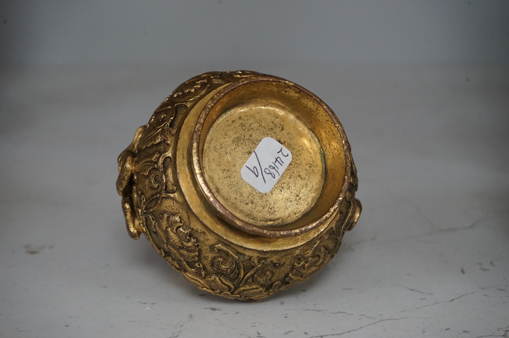 A Chinese gilt bronze vase decorated with applied lion dogs, 7.5cm high